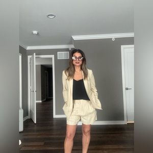 Two piece cream with black pinstriped. Never worn.